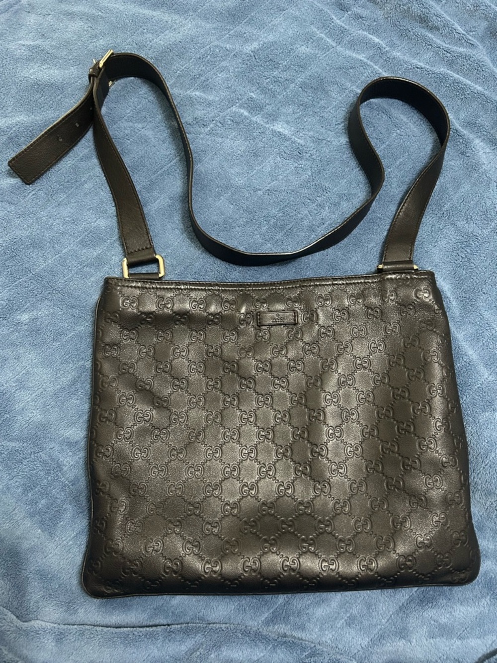 Gucci Guccissima Brown Embossed GG Leather Crossbody Bag.